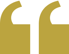 Gold quotation marks on black background.